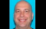This drivers license image released by the US Justice Department shows Robert Sanford, a retired firefighter who threw a fire extinguisher at police officers during the US Capitol riot on Jan. 6, 2021 (Justice Department via AP)