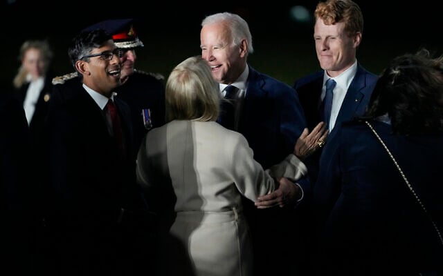 US President Joe Biden is greeted by British Prime Minister Rishi Sunak, left, and US Ambassador to the United Kingdom Jane Hartley, center, he steps off Air Force One at Belfast International Airport in Belfast, Northern Ireland, April 11, 2023. Biden is visiting the United Kingdom and Ireland in part to help celebrate the 25th anniversary of the Good Friday Agreement. At right is United States Special Envoy for Northern Ireland Joe Kennedy III. (AP Photo/Patrick Semansky) US President Joe Biden is greeted by British Prime Minister Rishi Sunak, left, and US Ambassador to the United Kingdom Jane Hartley, center, he steps off Air Force One at Belfast International Airport in Belfast, Northern Ireland, April 11, 2023. Biden is visiting the United Kingdom and Ireland in part to help celebrate the 25th anniversary of the Good Friday Agreement. At right is United States Special Envoy for Northern Ireland Joe Kennedy III. (AP Photo/Patrick Semansky)