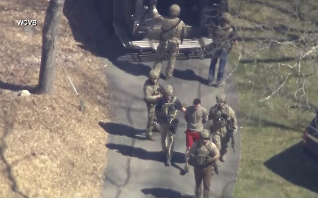This image made from video provided by WCVB-TV, shows Jack Teixeira, in T-shirt and shorts, being taken into custody by armed tactical agents in Dighton, Massachusetts, on, April 13, 2023. (WCVB-TV via AP) This image made from video provided by WCVB-TV, shows Jack Teixeira, in T-shirt and shorts, being taken into custody by armed tactical agents in Dighton, Massachusetts, on, April 13, 2023. (WCVB-TV via AP)