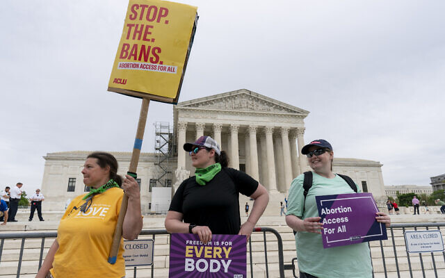 Doris Marlin, left, of Silver Spring, Md., and fellow activists demonstrate in front of the Supreme Court on Capitol Hill in Washington, Friday, April 14, 2023. The Supreme Court said Friday it was temporarily keeping in place federal rules for use of an abortion drug, while it takes time to more fully consider the issues raised in a court challenge. (AP/J. Scott Applewhite) Doris Marlin, left, of Silver Spring, Md., and fellow activists demonstrate in front of the Supreme Court on Capitol Hill in Washington, Friday, April 14, 2023. The Supreme Court said Friday it was temporarily keeping in place federal rules for use of an abortion drug, while it takes time to more fully consider the issues raised in a court challenge. (AP/J. Scott Applewhite)
