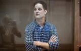 Wall Street Journal reporter Evan Gershkovich stands in a glass cage in a courtroom at the Moscow City Court, in Moscow, Russia, on Tuesday, April 18, 2023. (AP Photo/Alexander Zemlianichenko)
