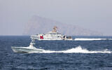 A US Navy L3 Harris Arabian Fox MAST-13 drone boat and the US Coast Guard cutter USCGC John Scheuerman transit the Strait of Hormuz on April 19, 2023 (Information Systems Technician 1st Class Vincent Aguirre/U.S. Coast Guard via AP)