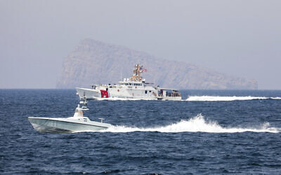 A US Navy L3 Harris Arabian Fox MAST-13 drone boat and the US Coast Guard cutter USCGC John Scheuerman transit the Strait of Hormuz on April 19, 2023 (Information Systems Technician 1st Class Vincent Aguirre/U.S. Coast Guard via AP)