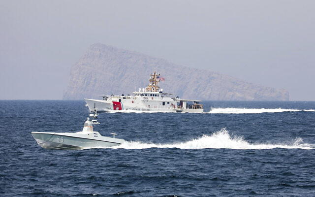 A US Navy L3 Harris Arabian Fox MAST-13 drone boat and the US Coast Guard cutter USCGC John Scheuerman transit the Strait of Hormuz on April 19, 2023 (Information Systems Technician 1st Class Vincent Aguirre/U.S. Coast Guard via AP) A US Navy L3 Harris Arabian Fox MAST-13 drone boat and the US Coast Guard cutter USCGC John Scheuerman transit the Strait of Hormuz on April 19, 2023 (Information Systems Technician 1st Class Vincent Aguirre/U.S. Coast Guard via AP)