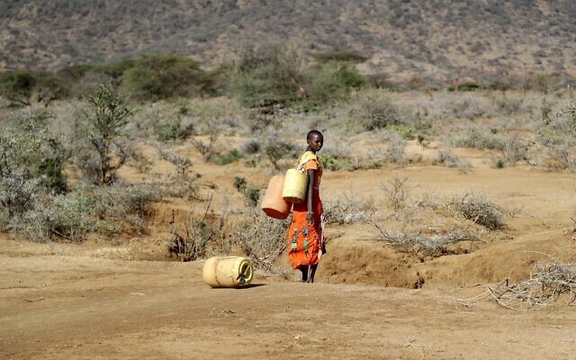 A Samburu woman fetches water during a drought in Loolkuniyani Primary School, Samburu County, Kenya, Oct. 16, 2022. (AP Photo/Brian Inganga, File) A Samburu woman fetches water during a drought in Loolkuniyani Primary School, Samburu County, Kenya, Oct. 16, 2022. (AP Photo/Brian Inganga, File)