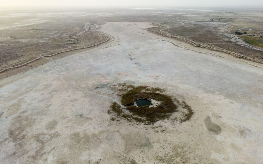 A dried Sawa Lake is surrounded by a dry bed in Iraq, Monday, April 10, 2023. (AP/Anmar Khalil)