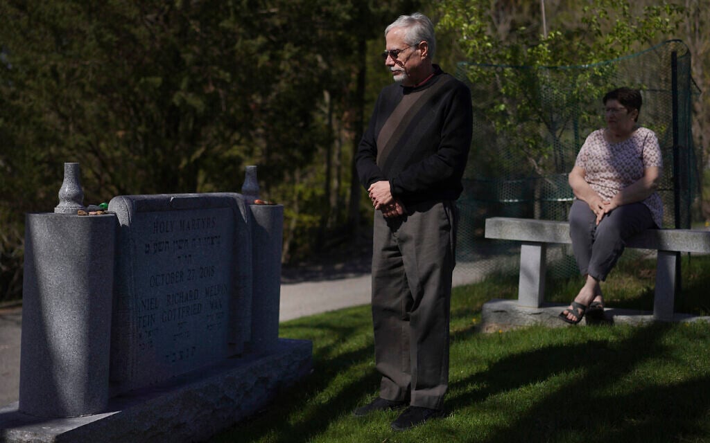 Co-presidents of New Light Congregation, Stephen Cohen and Barbara Caplan, visit a memorial in the New Light Cemetery on Wednesday, April 19, 2023, in Shaler Township, Pennsylvania, honoring the congregants they lost during the Pittsburgh synagogue massacre over four years ago. (AP Photo/Jessie Wardarski) Co-presidents of New Light Congregation, Stephen Cohen and Barbara Caplan, visit a memorial in the New Light Cemetery on Wednesday, April 19, 2023, in Shaler Township, Pennsylvania, honoring the congregants they lost during the Pittsburgh synagogue massacre over four years ago. (AP Photo/Jessie Wardarski)