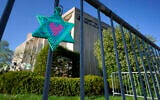 A Star of David hangs from a fence outside the dormant landmark Tree of Life synagogue in Pittsburgh's Squirrel Hill neighborhood on April 19, 2023. (Gene J. Puskar/AP)