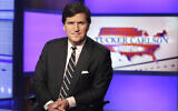 Tucker Carlson, host of 'Tucker Carlson Tonight,' poses for photos in a Fox News Channel studio on March 2, 2017, in New York. (AP Photo/Richard Drew, File)