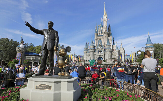 A statue of Walt Disney and Micky Mouse stands in front of the Cinderella Castle at the Magic Kingdom at Walt Disney World in Lake Buena Vista, Florida, January 9, 2019 (AP/John Raoux, File) A statue of Walt Disney and Micky Mouse stands in front of the Cinderella Castle at the Magic Kingdom at Walt Disney World in Lake Buena Vista, Florida, January 9, 2019 (AP/John Raoux, File)