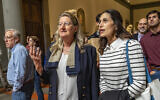 Hope Carrasquilla, the former Dean of the Tallahassee Classical School, Florida (right) with Cecilie Hollberg, director of Florence's Galleria dell'Accademia museum looking at Michelangelo Buonarroti's colossal marble statue "David," in Florence, central Italy, April 28, 2023. (Guido Cozzi/Galleria dell'Accademia di Firenze via AP)