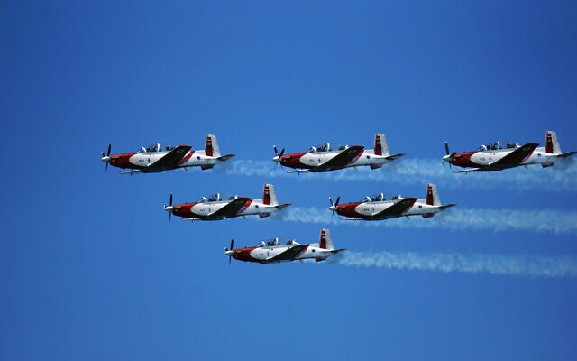 IAF T-6 Texan II planes fly over Tel Aviv while performing during an air show as part of Independence Day celebrations on April 26, 2023. (Emanuel Fabian/Times of Israel)