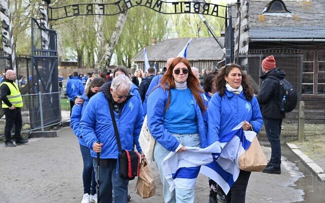 People gather at the Auschwitz-Birkenau former Nazi death camp on Polish soil, ahead of the annual March of the Living, April 18, 2023. (Canaan Lidor/Times of Israel) People gather at the Auschwitz-Birkenau former Nazi death camp on Polish soil, ahead of the annual March of the Living, April 18, 2023. (Canaan Lidor/Times of Israel)