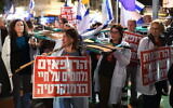 Israeli doctors carrying 'Doctors Fighting for Democracy' attend a rally against the government's judicial overhaul bills, Tel Aviv, February 25, 2023. (Gili Yaari /Flash90)