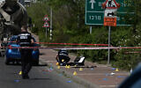 Police at the scene of a terror attack in Tzrifin, where two soldiers were injured, April 4, 2023 (Avshalom Sassoni/FLASH90)