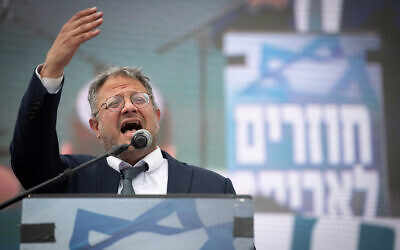 National Security Minister Itamar Ben Gvir takes part in a march to the Evyatar outpost, near the West Bank city of Nablus, during the Passover holiday, on April 10, 2023. (Sraya Diamant/Flash90)