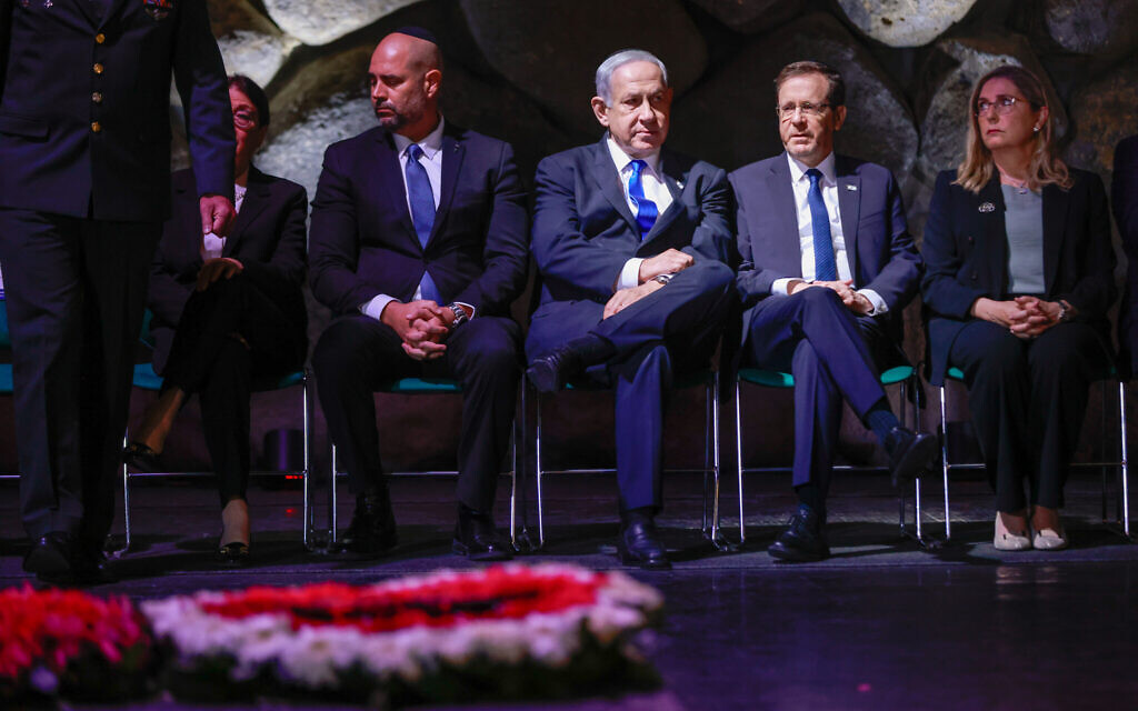Right to left: President Isaac Herzog, Prime Minister Benjamin Netanyahu, Knesset Speaker and Supreme Court President Esther Hayut at a ceremony in the Hall of Remembrance at the Yad Vashem holocaust museum in Jerusalem, on Holocaust Remembrance Day on April 18, 2023. (Erik Marmor/Flash90)