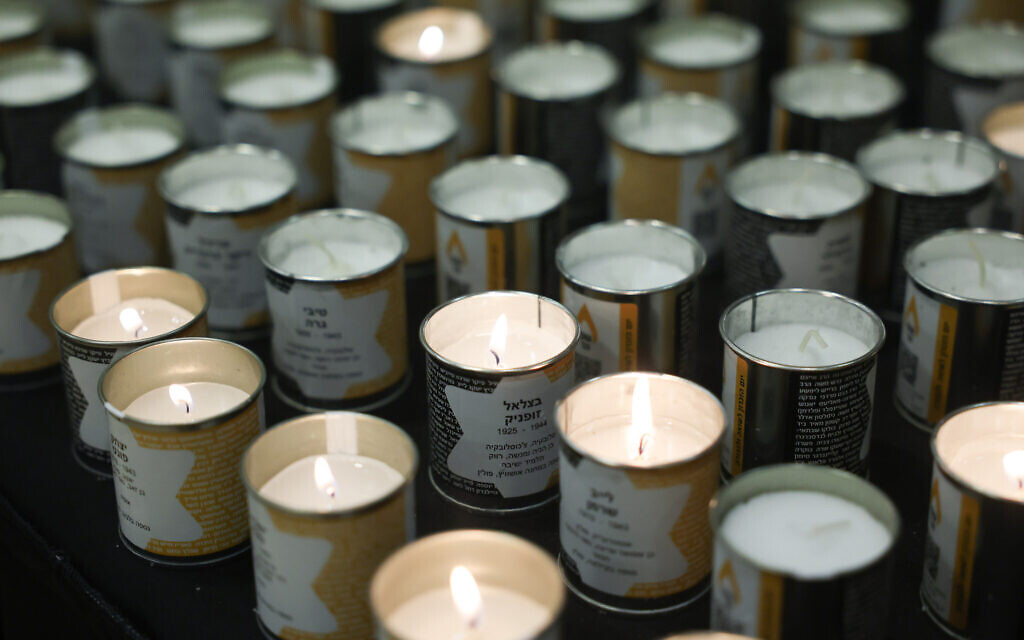 Candles lit in honor of the Jews killed in the Holocaust, ahead of a ceremony at the Knesset in Jerusalem as Israel marks Holocaust Remembrance Day, April 18, 2023. (Yonatan Sindel/FLASH90)