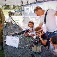 People visit an IDF fair in Gush Etzion, as part of Israel's 75th Independence Day celebrations, on April 26, 2023. (Gershon Elinson/Flash90) People visit an IDF fair in Gush Etzion, as part of Israel's 75th Independence Day celebrations, on April 26, 2023. (Gershon Elinson/Flash90)