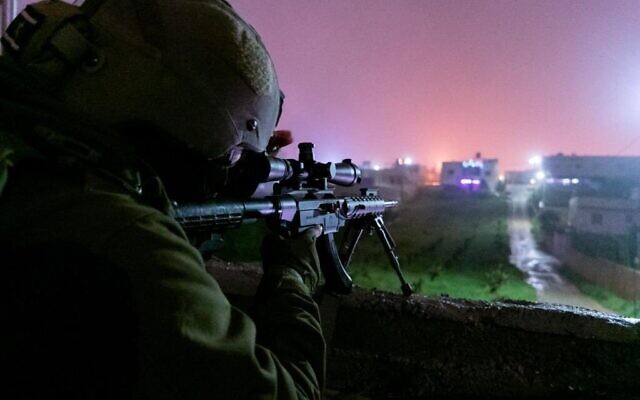 An IDF marksman is seen during an early morning operation in the West Bank, April 13, 2023. (Israel Defense Forces) An IDF marksman is seen during an early morning operation in the West Bank, April 13, 2023. (Israel Defense Forces)