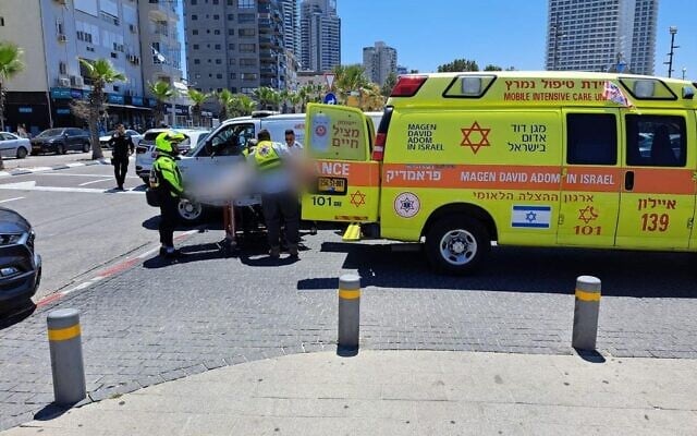 Magen David Adom medics treat a man who was attacked in an apparent road rage incident in Bat Yam on April 25, 2023 (MDA) Magen David Adom medics treat a man who was attacked in an apparent road rage incident in Bat Yam on April 25, 2023 (MDA)