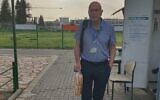 Gal Ifergane, the director of the neurology department, poses outside Soroka Medical Center in Beersheba with rolls he brought in to protest a ban on such products in hospitals during the Passover holiday. (Gal Ifergane, via Facebook)