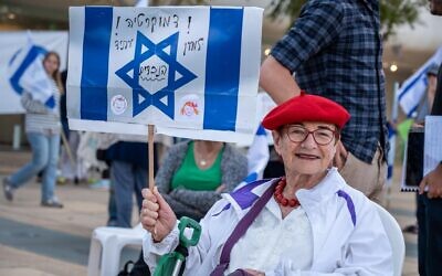 A woman takes part in a grandmothers' protest in Tel Aviv against the government's judicial overhaul plan, April 20, 2023. (Stav Tzur)