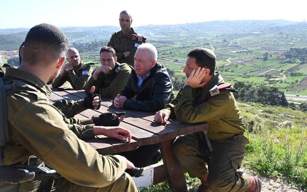 Defense Minister Yoav Gallant (second from right), during a briefing in the West Bank on April 2, 2023. (Ariel Hermoni/ Defense Ministry) Defense Minister Yoav Gallant (second from right), during a briefing in the West Bank on April 2, 2023. (Ariel Hermoni/ Defense Ministry)