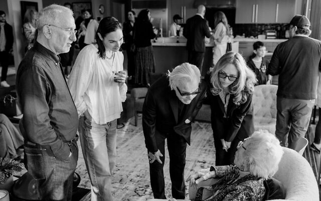 Gal Gadot hosted Holocaust survivor Celina Biniaz, being greeted by Harvey Keitel, for a Zikaron Basalon event on Holocaust Remembrance Day, April 18, 2023 (Courtesy Tori, DMWA)