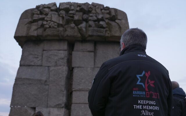 A member of a Rambam Medical Center delegation to the March of the Living visits a Holocaust memorial site, in Poland, April 16, 2023. (Courtesy: Rambam)
