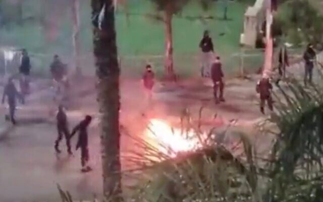 In this screenshot of video from social media, rioters burn tires in the northern Arab Israeli city of Umm al-Fahm, April 6, 2023. (Screenshot/Twitter; Used in accordance with Clause 27a of the Copyright Law) In this screenshot of video from social media, rioters burn tires in the northern Arab Israeli city of Umm al-Fahm, April 6, 2023. (Screenshot/Twitter; Used in accordance with Clause 27a of the Copyright Law)