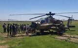 Screen capture from video of an IAF Apache helicopter that landed close to Kibbutz Ga'ash due to a technical fault, April 26, 2023. (Twitter. Used in accordance with Clause 27a of the Copyright Law)