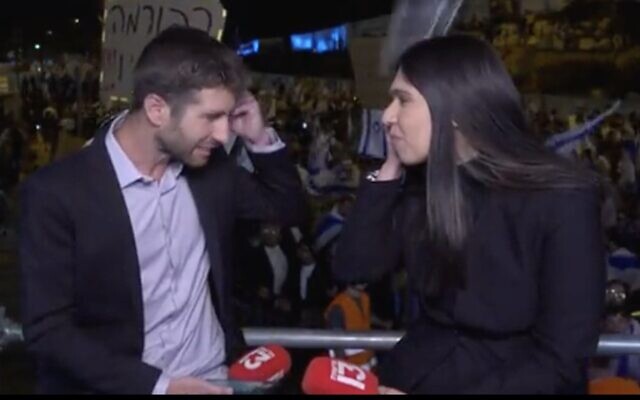 A glass bottle is thrown at Channel 13 correspondents Moriah Asraf Wolberg and Yishai Porat as they report on a mass right-wing rally in Jerusalem, April 27, 2023. (Twitter. Used in accordance with Clause 27a of the Copyright Law) A glass bottle is thrown at Channel 13 correspondents Moriah Asraf Wolberg and Yishai Porat as they report on a mass right-wing rally in Jerusalem, April 27, 2023. (Twitter. Used in accordance with Clause 27a of the Copyright Law)