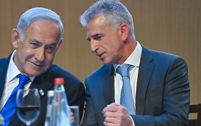 Illustrative: Prime Minister Benjamin Netanyahu (left) and Mossad chief David Barnea at a pre-Passover toast April 4, 2023. (Kobi Gideon/GPO)