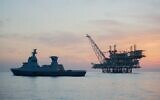 An Israeli Navy Sa’ar 6-class corvette guards the Energean floating production, storage and offloading vessel at the Tamar gas field, in an image published by the military on April 23, 2023. (Israel Defense Forces)