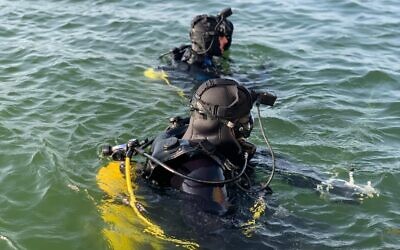 In this undated handout photo, Israeli troops take part in rescue efforts at the Sea of Galilee. (Israel Defense Forces)