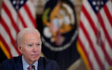 US President Joe Biden listens to a reporter's question during a meeting with the President's Council of Advisors on Science and Technology in the State Dining Room of the White House, April 4, 2023, in Washington. (AP Photo/Patrick Semansky)