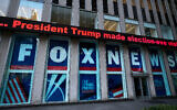 A headline about then US president Donald Trump is displayed outside Fox News studios in New York on November 28, 2018. (AP Photo/Mark Lennihan, File)