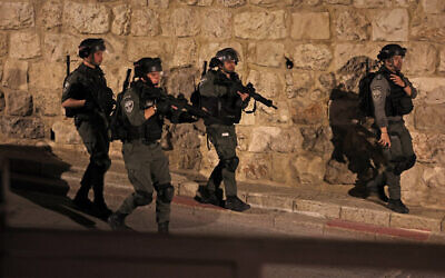 Border Police stand guard outside the Al-Aqsa Mosque on the Temple Mount  in Jerusalem's Old City during clashes with Palestinians, on April 5, 2023. (Ahmad Gharabli/AFP)