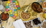 A mimouna spread in Safed, April 12, 2023. (Ayal Margolin/Flash90)