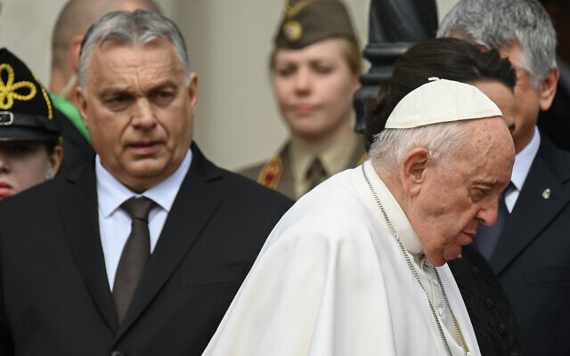Hungary's Prime Minister Viktor Orban, left, looks on as Pope Francis walks away after a welcoming ceremony at Sandor Palace in Budapest on April 28, 2023. (Vincenzo Pinto/AFP) Hungary's Prime Minister Viktor Orban, left, looks on as Pope Francis walks away after a welcoming ceremony at Sandor Palace in Budapest on April 28, 2023. (Vincenzo Pinto/AFP)