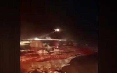 A rescue helicopter seen during a search and rescue operation in southern Israel amid flash floods in the Negev, April 10, 2023. The IDF says it rescued 26 civilians in southern Israel on Monday night. (Channel 12/screenshot; used in accordance with Clause 27a of the copyright law)