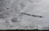 A plane trails a banner congratulating Israel on her 75th independence day in the Netherlands on April 26, 2023. (Courtesy of Christians for Israel)