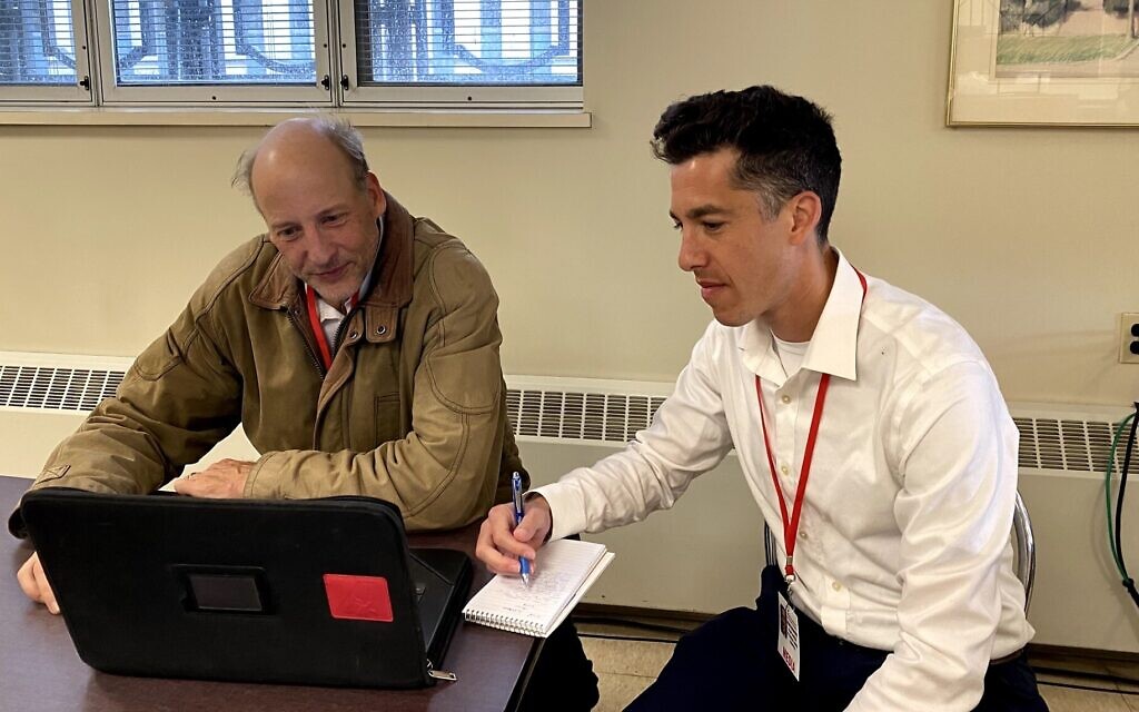 Torsten Ove, left, of the Pittsburgh Union Progress and Adam Reinherz of the PIttsburgh Jewish Chronicle confer on the first day of jury selection for the Pittsburgh synagogue massacre trial, April 24, 2023. (Toby Tabachnick via JTA) Torsten Ove, left, of the Pittsburgh Union Progress and Adam Reinherz of the PIttsburgh Jewish Chronicle confer on the first day of jury selection for the Pittsburgh synagogue massacre trial, April 24, 2023. (Toby Tabachnick via JTA)