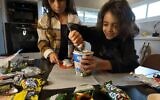 Children participating in a trend, rolling up ice-cream with Fruit Roll-Ups. (YouTube screenshot: used in accordance with Clause 27a of the Copyright Law)