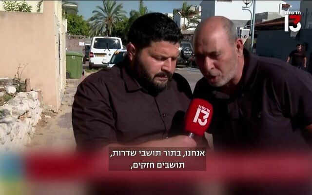 A man interrupts an interview with Otzma Yehudit MK Almog Cohen in the southern town of Sderot, May 2, 2023. (Channel 13 screenshot: used in accordance with Clause 27a of the Copyright Law) A man interrupts an interview with Otzma Yehudit MK Almog Cohen in the southern town of Sderot, May 2, 2023. (Channel 13 screenshot: used in accordance with Clause 27a of the Copyright Law)