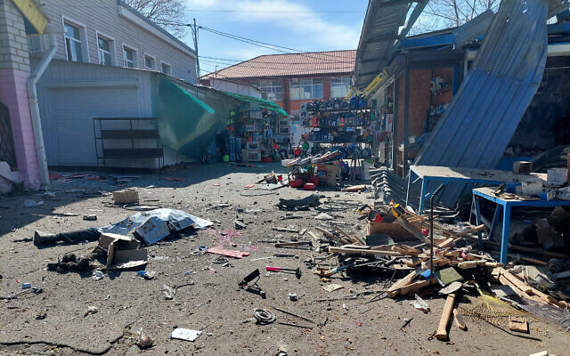 File: The body of a local resident lies at a market in the center of the Ukrainian city of Kherson following a Russian shelling, on April 18, 2023. (Dina Pletenchuk/AFP) File: The body of a local resident lies at a market in the center of the Ukrainian city of Kherson following a Russian shelling, on April 18, 2023. (Dina Pletenchuk/AFP)