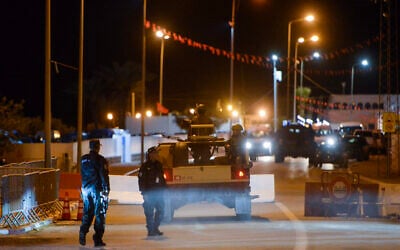 In this picture taken on May 9, 2023, police secure an area near the Ghriba synagogue following a shooting attack on the resort island of Djerba  (YASSINE MAHJOUB / AFP)