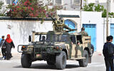 Tunisian soldiers secure an area near the Ghriba synagogue following a shootout on the resort island of Djerba on May 10, 2023. (Fethi Belaid/AFP)