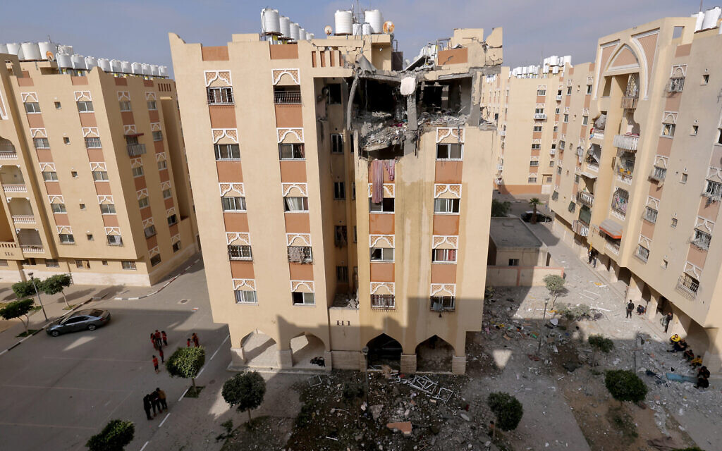 A picture shows a building housing the apartment (top floor) of an Islamic Jihad military leader, which was destroyed by an Israeli air strike in Khan Yunis, early on May 11, 2023. (SAID KHATIB / AFP)